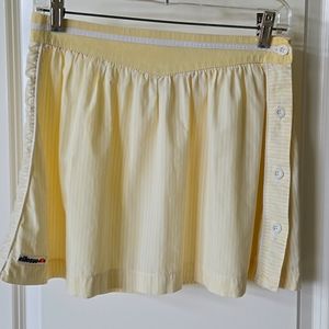 Vintage Ellesse tennis skirt. Yellow and white stripe, side buttons, cotton
